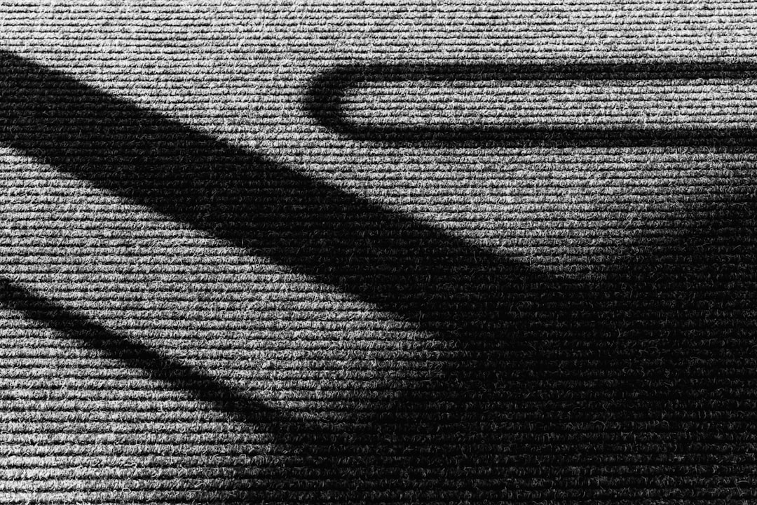 the shadow of a computer mouse on a computer keyboard