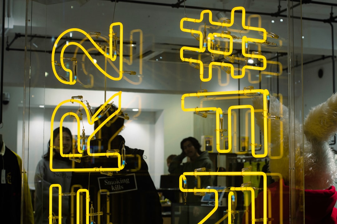 several people standing beside glass wall