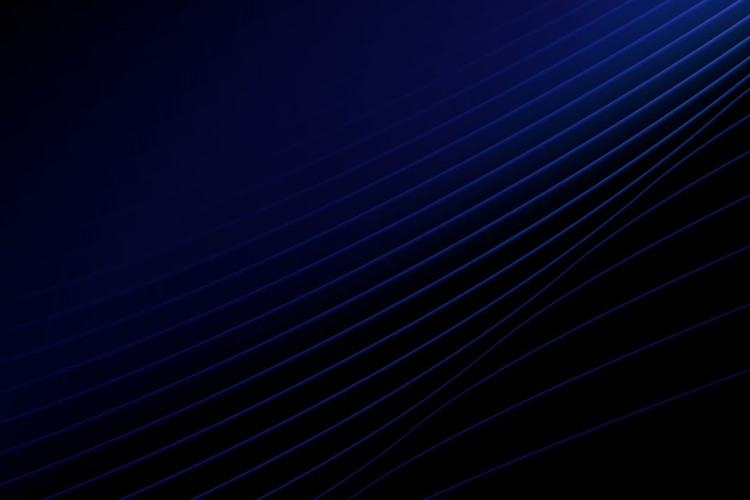 Abstract blue lines against a dark background.