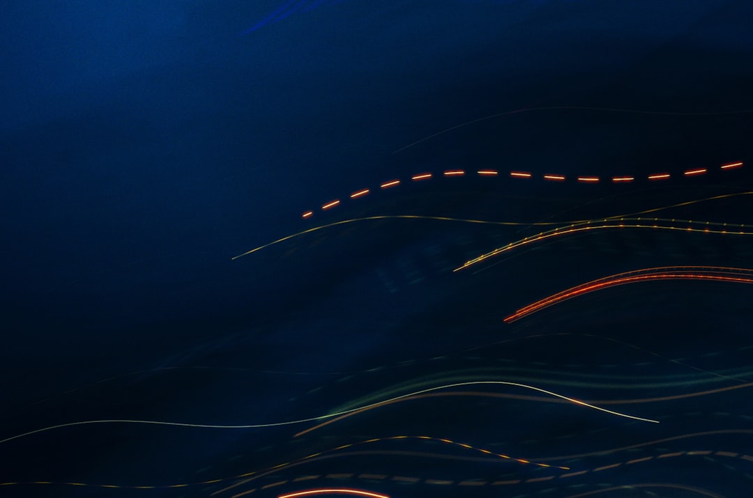 Abstract lines appear against a dark blue background.