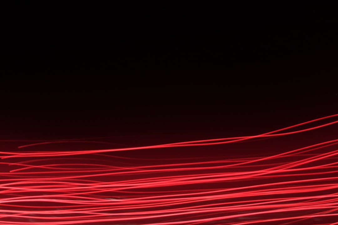 a blurry photo of red lights in the dark